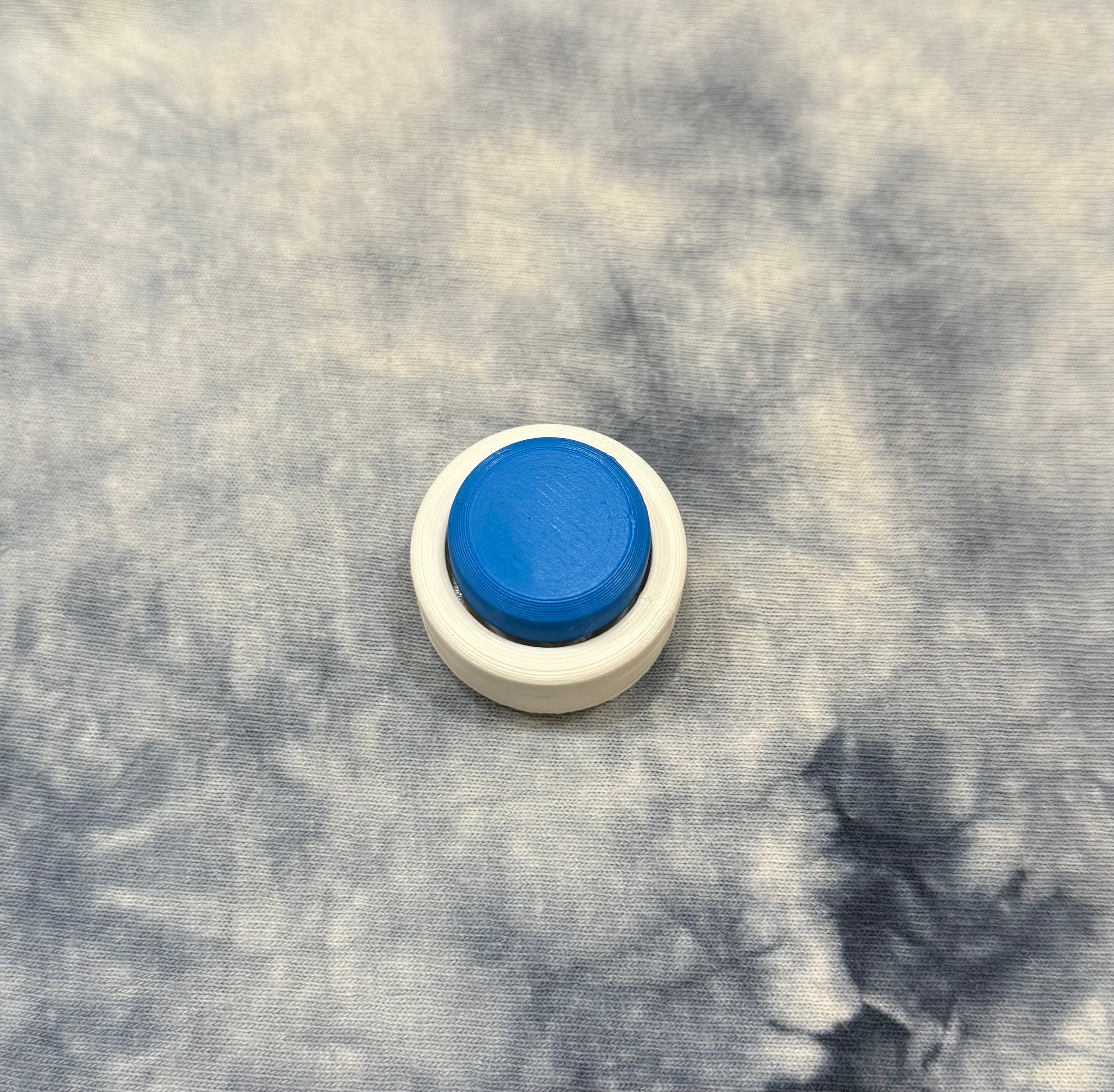 Larger Snow Cap model with clean white base and blue cap, offering tactile feedback for desktop executive toy use.